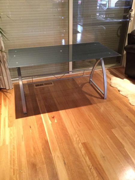 Desk with glass top and metal legs. Could be used as a table as well