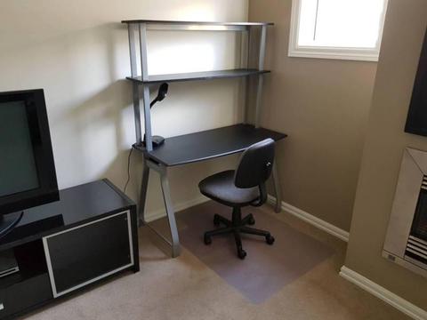 Black and silver desk with shelves