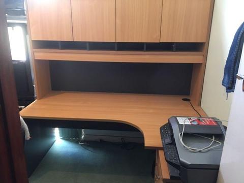 Office desk suite with filing cabinet drawer and hutch