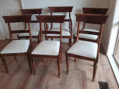 Price dripped on antique wooden dining chairs with carver