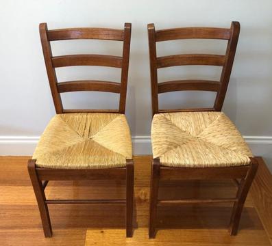 Pair of wooden chairs with woven seat