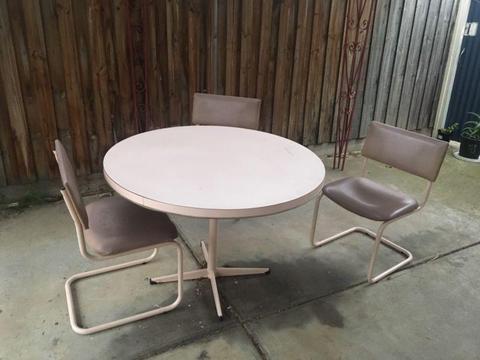 Table and three chairs
