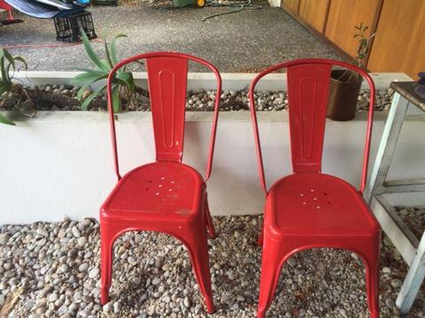 Two red vintage chairs