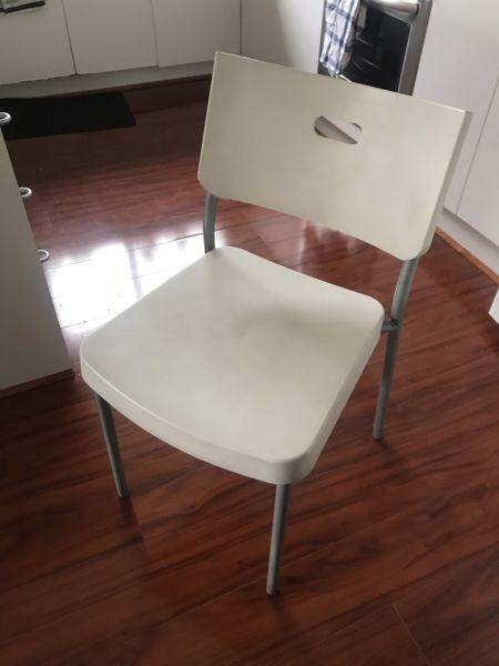 Two white Ikea chairs