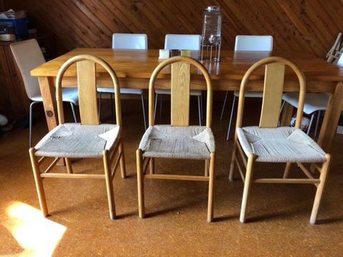 Three wood and wicker rattan dining chairs very solid and sturdy