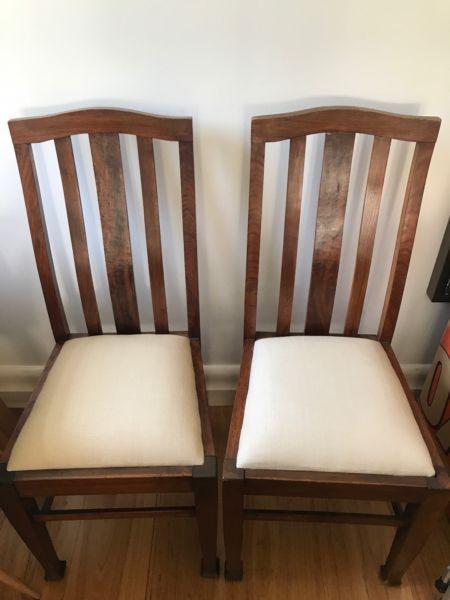 Pair of solid timber with newly upholstered seats dining chairs