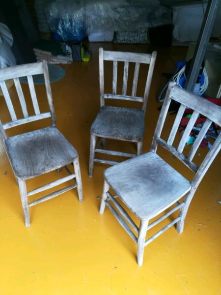 Three sturdy old hardwood chairs