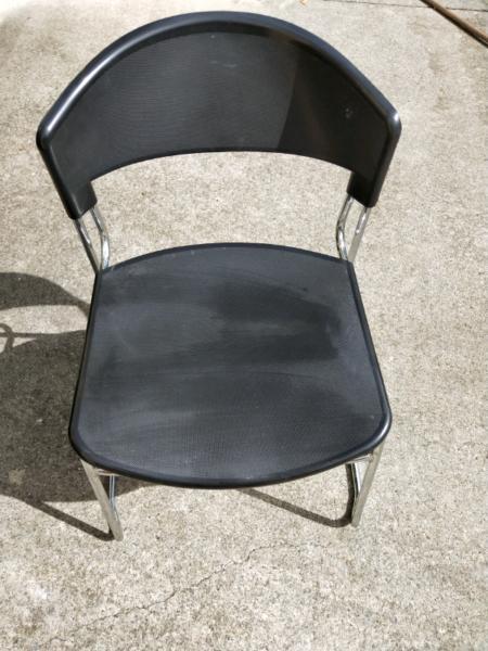 Crome and black plastic chairs