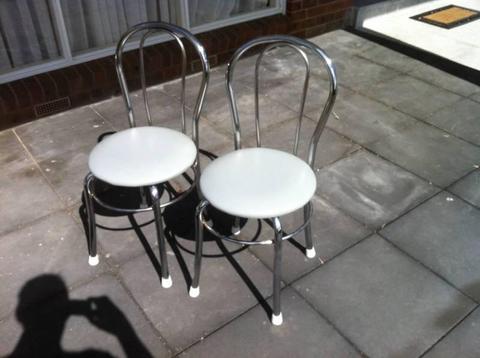 Two steel frame dining chairs in good condition