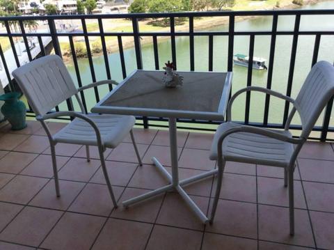Two outdoor chairs plus table