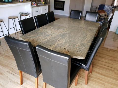 Granite table with leather chairs