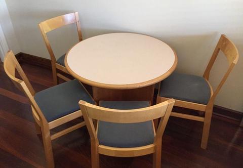 Four Chairs and One Round Table