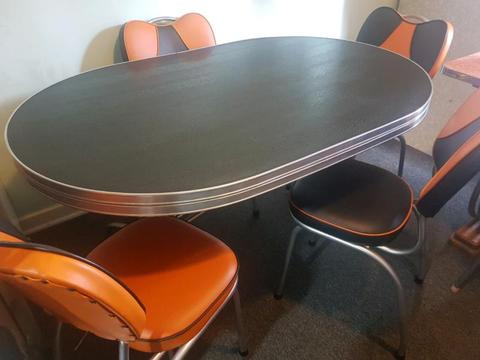 Funky retro dining suite with black and orange or white chairs