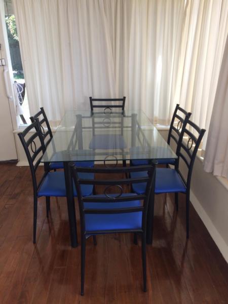 Glass top table and 6 chairs