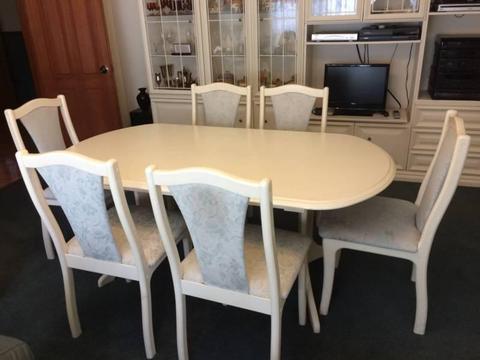 White lacquer dining setting . Six place with extending table