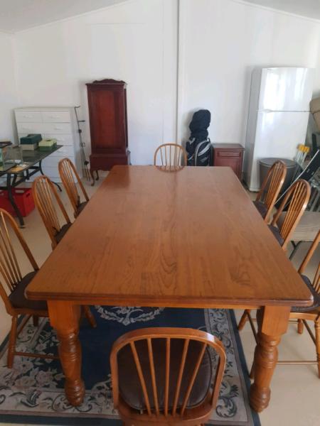 8 seater solid dinning table and chairs