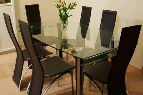 glass dining table with 6 chairs