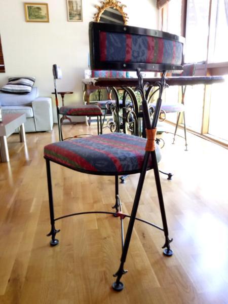 Wrought iron table and 8 chairs