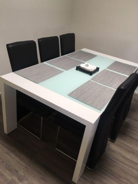 White gloss dining table with glass top