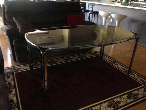 Chrome dining table with smoked glass top and six chairs