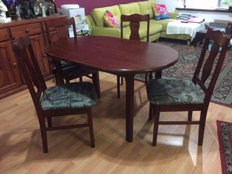 Wooden dining table and upholstered chairs