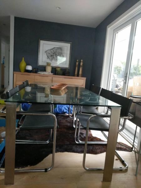 Solid glass and stainless steal dining table