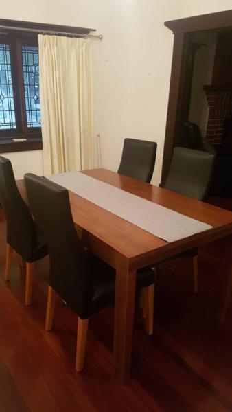 Solid wooden table and 4 leather chairs