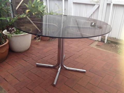 Round Glass Topped Dinner Table