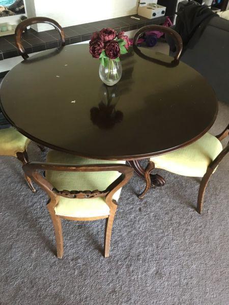 Antique round wood dining table