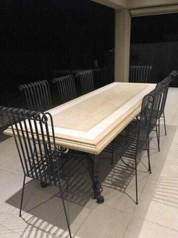 Maison stone table on wrought iron base with 8 cast iron chairs