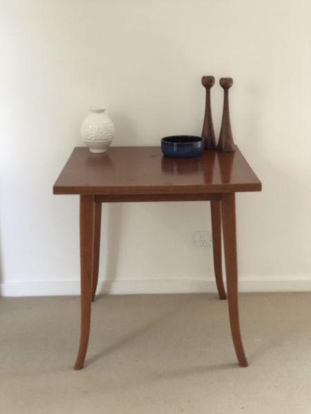 Unusual table with curved legs