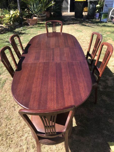 Oak extendable dining table with 6 leather chairs