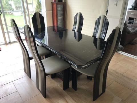 Black marble dining table and six chairs
