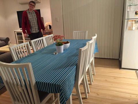 Ikea white extendable dining table with 8 chairs