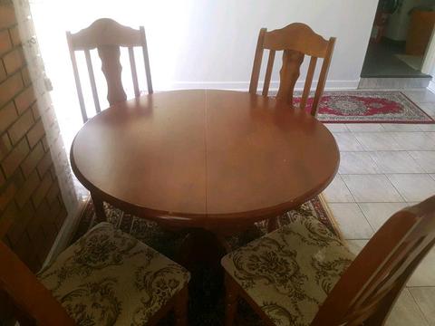 CIRCLE DINING TABLE. EXTENDS TO OVAL SHAPE WITH CHAIRS