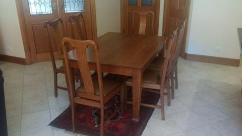 Solid timber dining table with six highback chairs