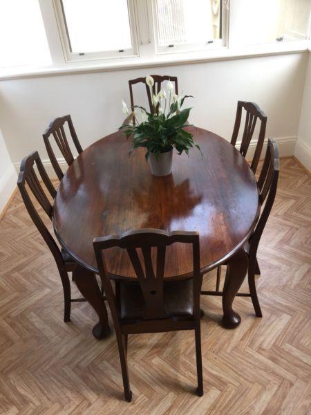 Stunning solid wood dining table with 6 matching chairs