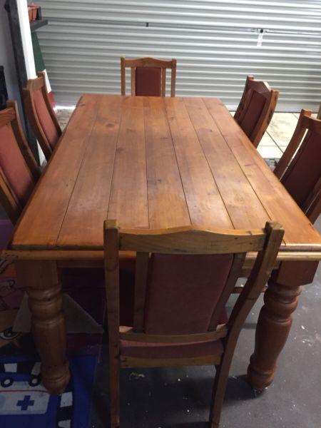 Solid heavy wood table and 6 chairs Good condition deliver for fee