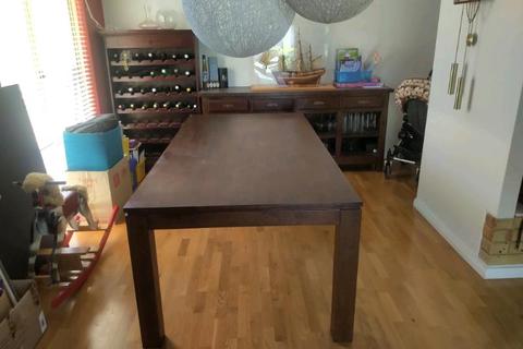 Classy, solid dark wood 8-seat dining table