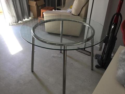 round glass table with chrome frame - (Ikea)