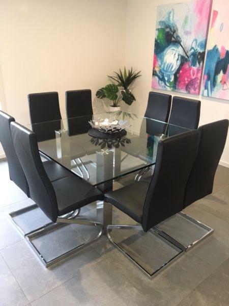 Glass dining table - 8 black leather seats