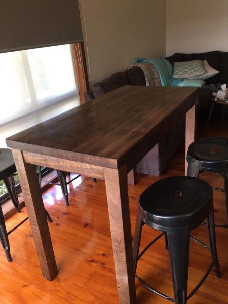 Wooden bar table and metal stools