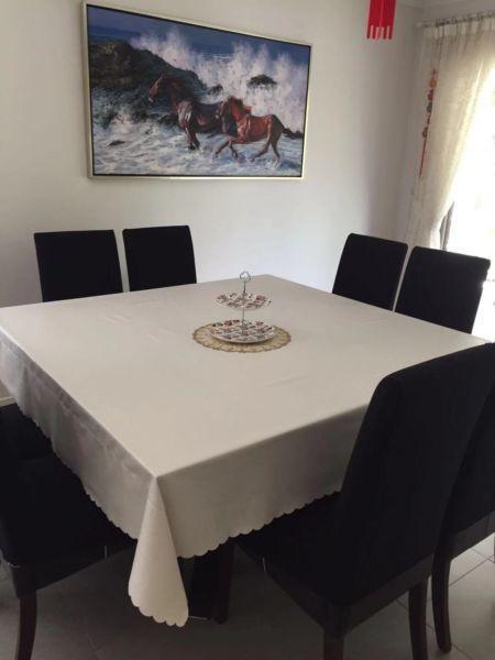 Nice glass top dining table with 8 leather chairs