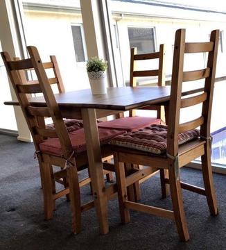 Foldable timber dining table with 4 chairs
