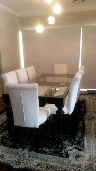 8 seater dining table with 8 white leather chairs