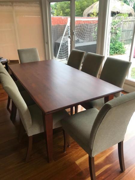A newly varnished solid wood dining room table