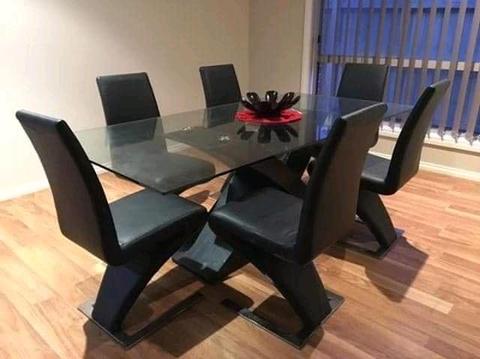 8 seater GLASS DINING TABLE with black leather seats
