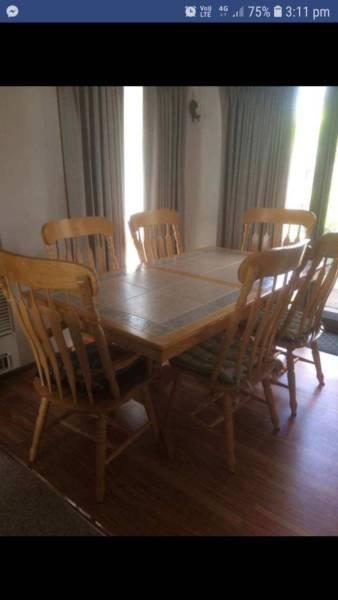 Dining table with 6 wooden chairs