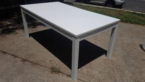 Extendable white dining room table