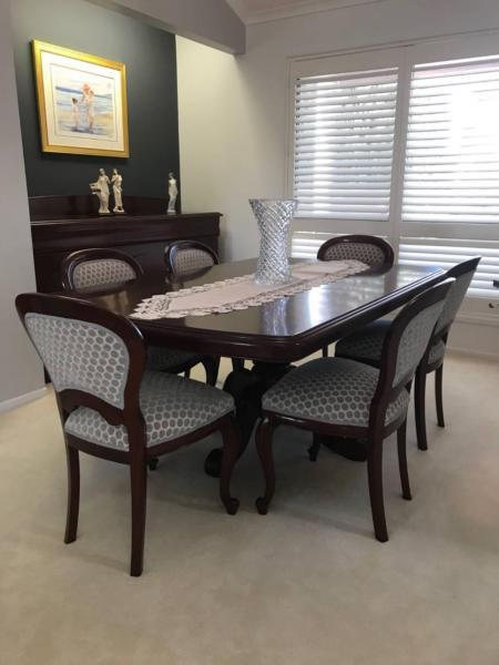 Custom designed solid wood dining table and 6 seats